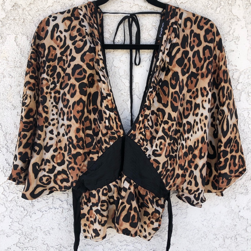 bebe leopard print top with a very deep V neckline